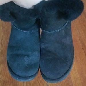 Black short uggs with button detail